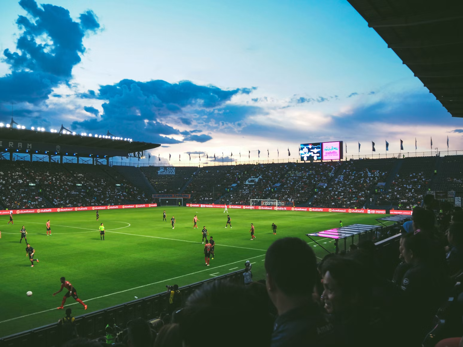 Football match in a packed stadium